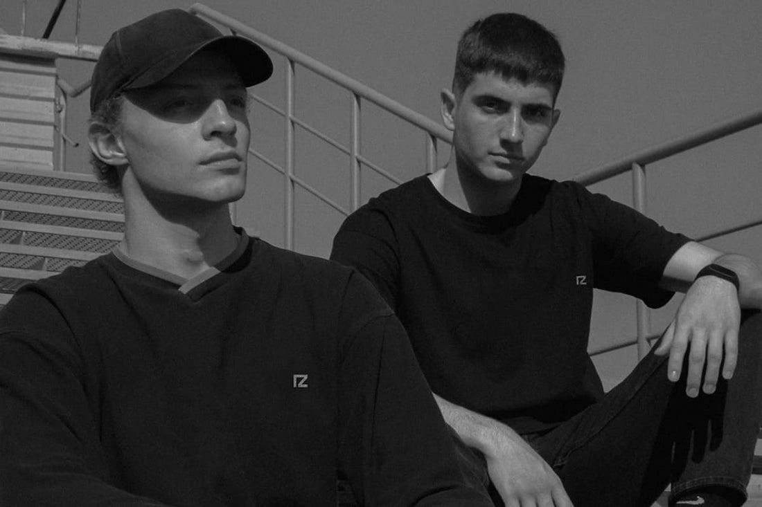 Two male models wearing modern t-shirts showcasing stylish men’s fashion in Pakistan 2026