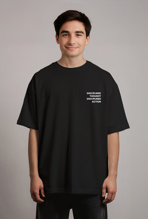 Person wearing a black t-shirt with white text on a gray background
